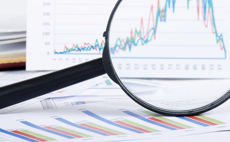 magnifying glass over graphs