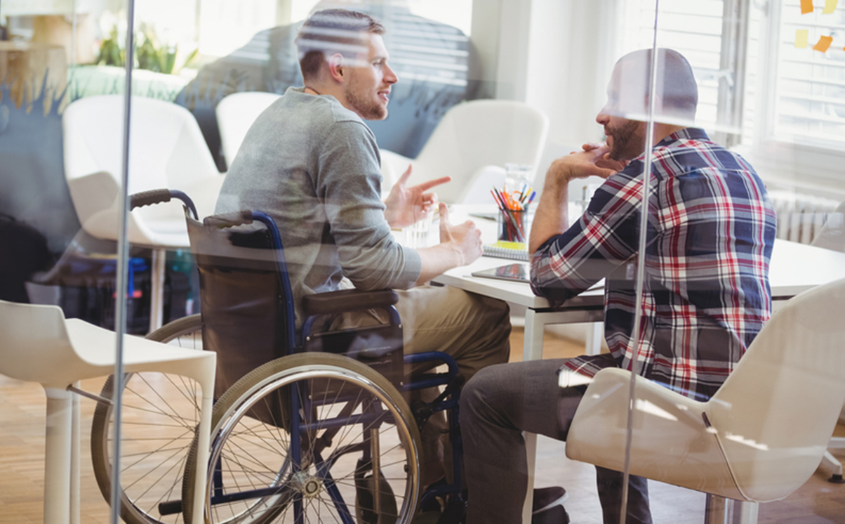 Wheelchair user office meeting